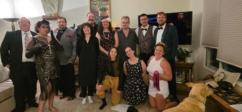 Customers in 1920s costumes at a Masters of Mystery murder mystery house party — verified Loox review photo
