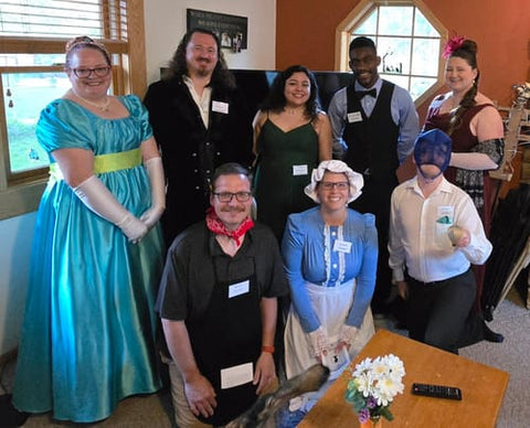 Friends in Regency costumes playing the Bridgerton murder mystery — verified Loox review photo