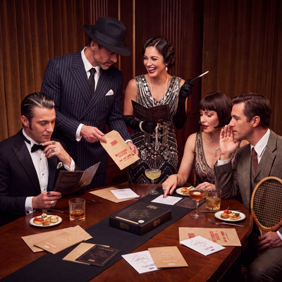 1920s Murder Mystery Game being played by guests at a themed party – 1x1 lifestyle image