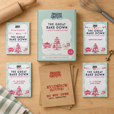 The Great Bake Down! by Masters of Mystery: game box and contents in a themed flat lay.
