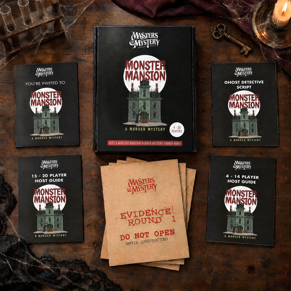 Masters of Mystery Mystery at Monster Mansion game box and printed contents arranged in a themed overhead flat lay.
