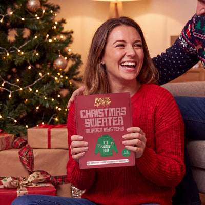 Office Christmas Murder Mystery Game boxed game being given as a gift – 1x1 lifestyle image